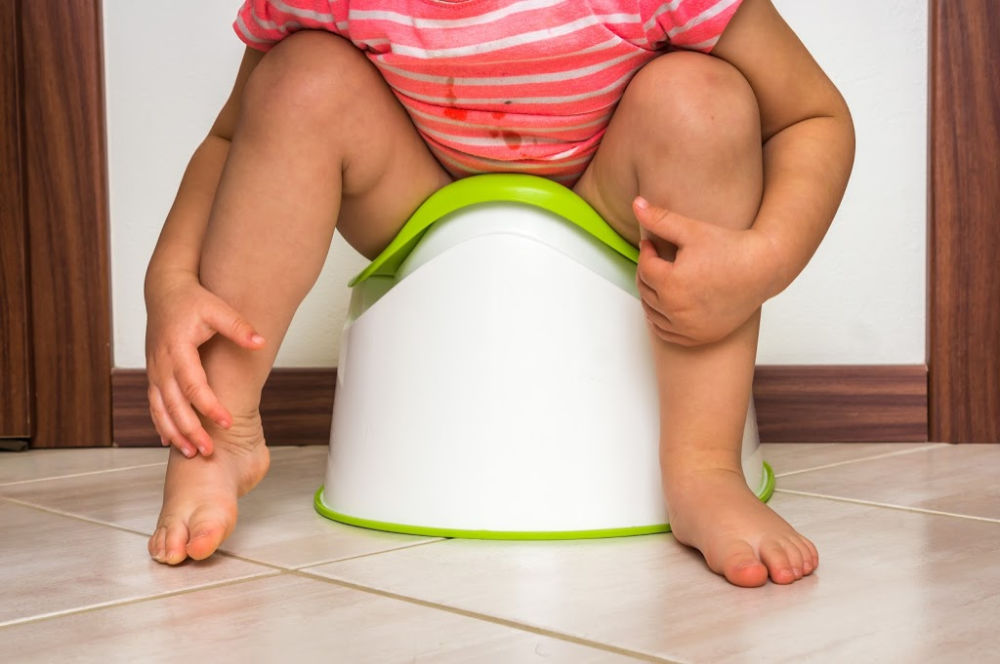 child on potty learning how to potty train