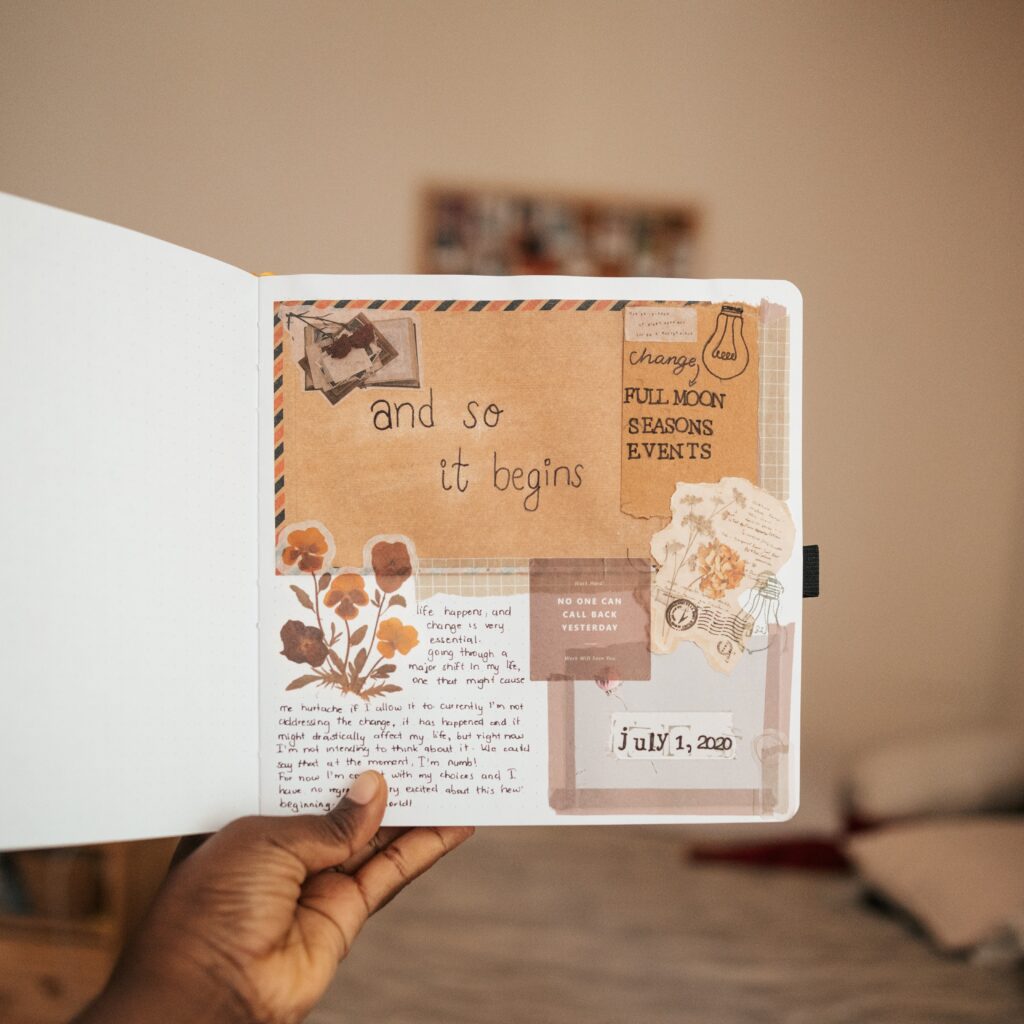 a scrapbook showing paper cutouts and flower stickers