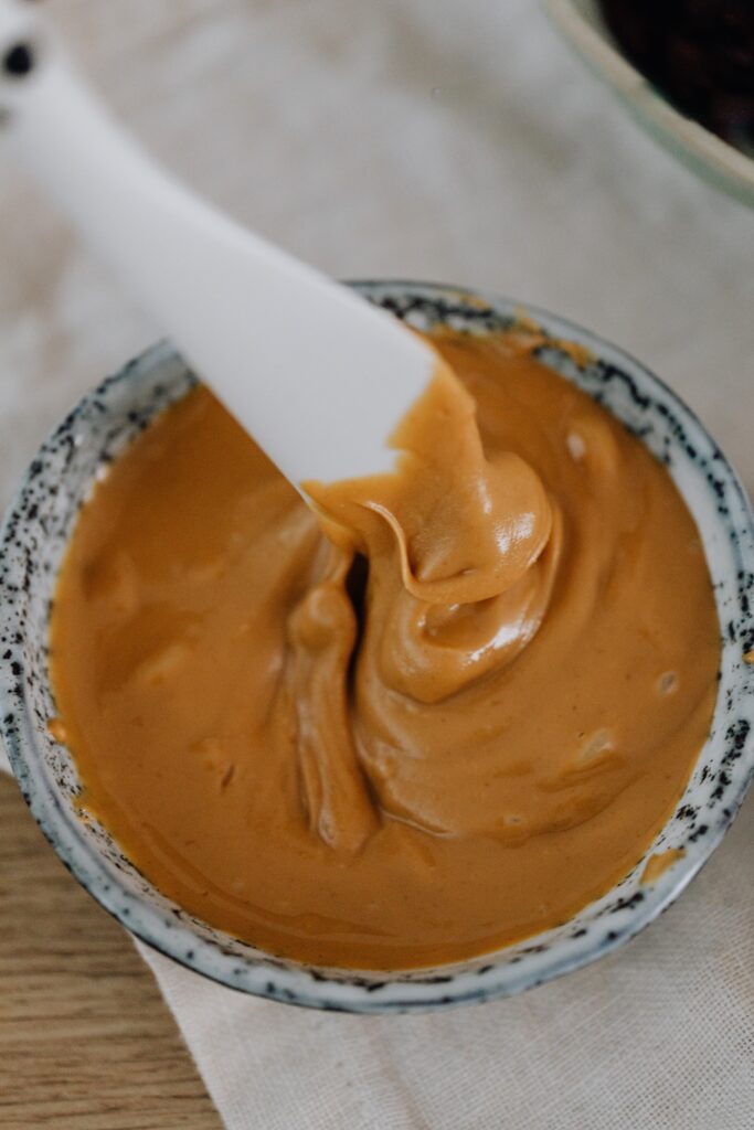 A dish of creamy peanut butter ready for your picky eater to enjoy on toast or crackers.