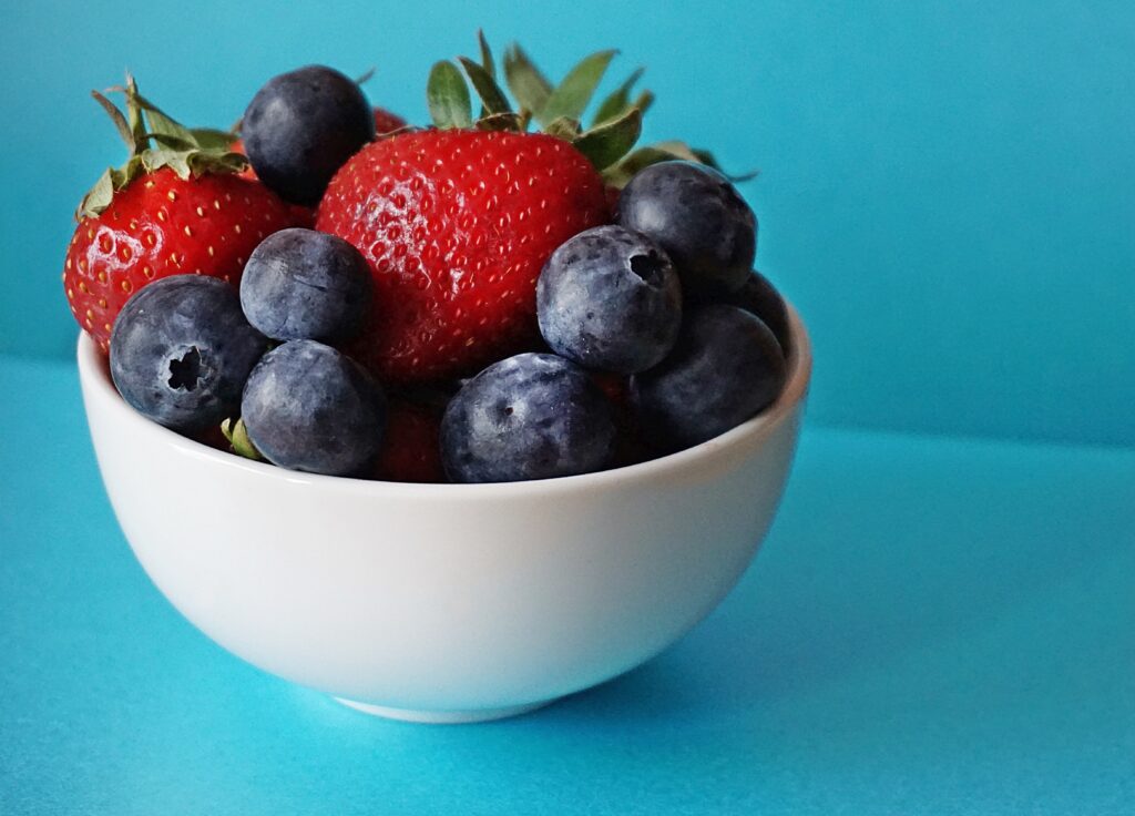 A white bowl full of fresh berries for your picky eater.